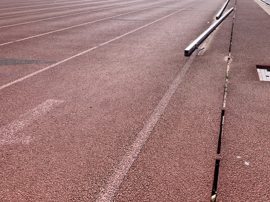 This running track is getting the works from RS Global: a deep track cleaning, running track repairs, drain clean out, and re-striping.